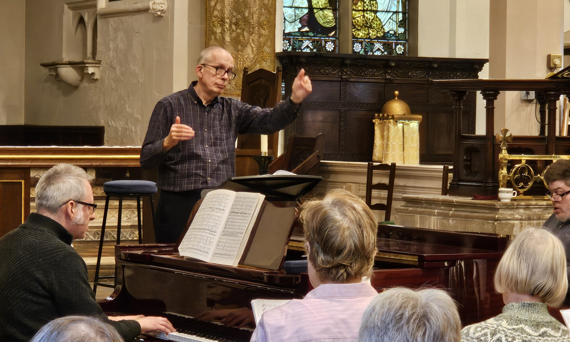 Nick Houghton conducts a choral workshop with Howard Beech on Piano accompaniment